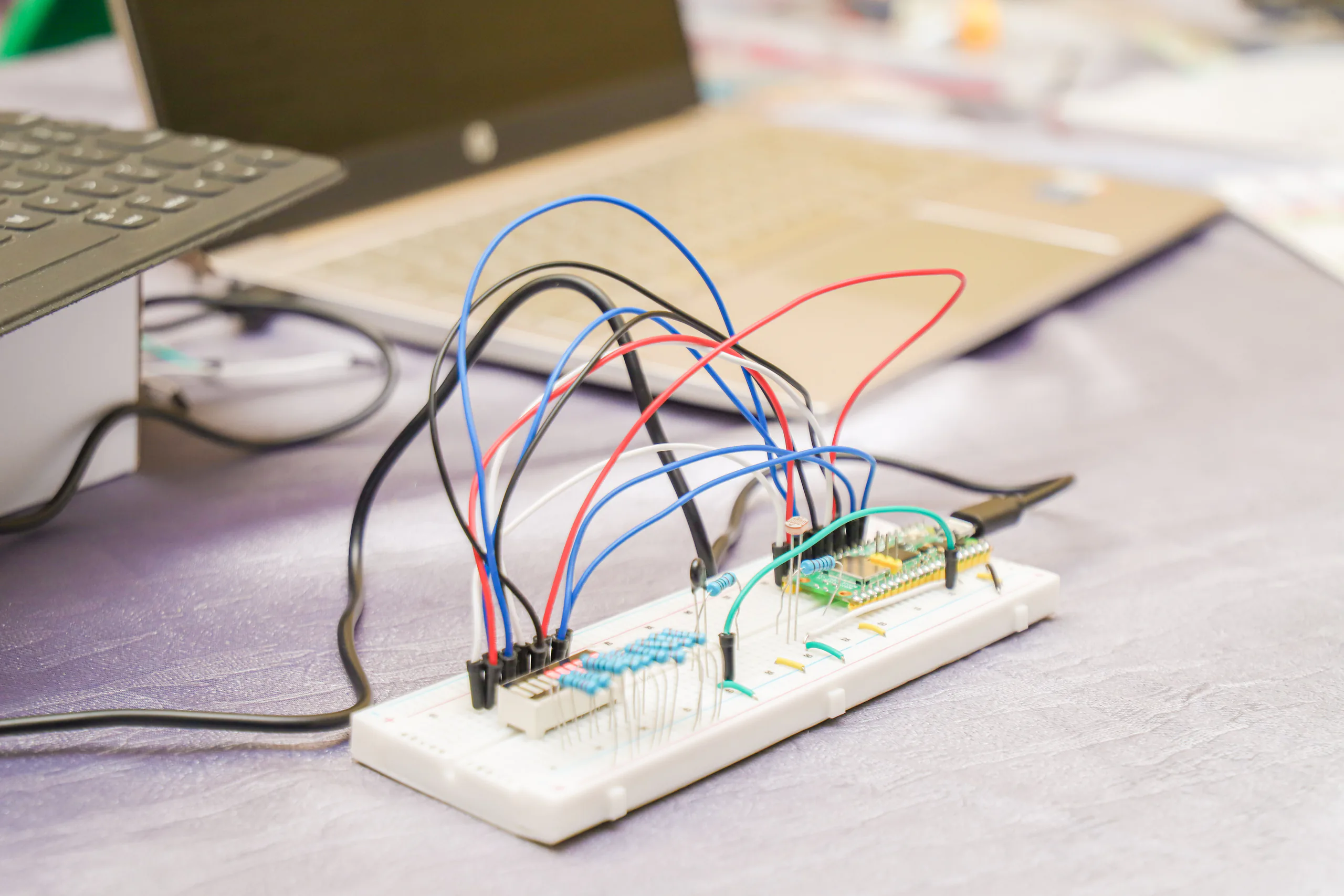 A breadboard circuit with jumper wires during a Raspberry Pi project.