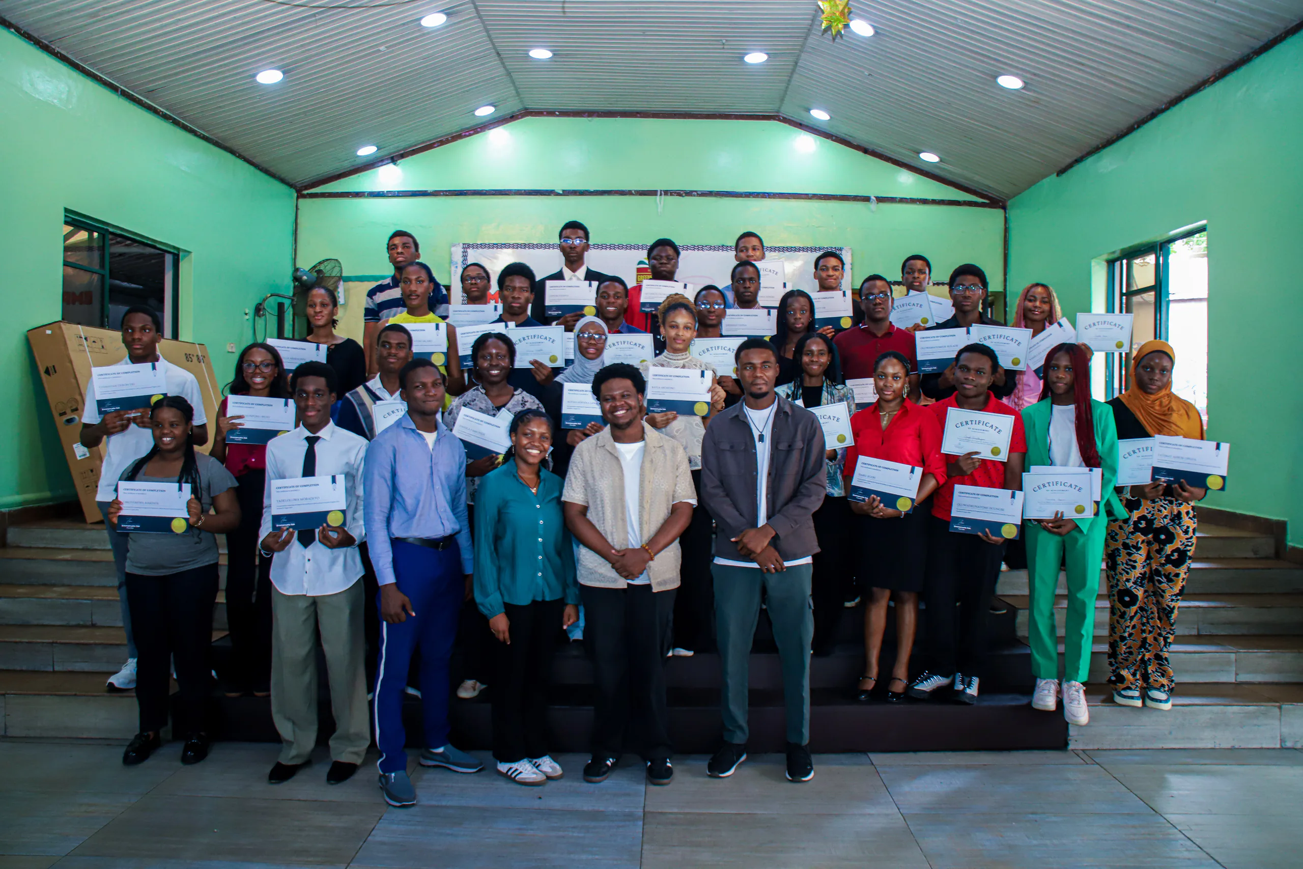 The PEAR cohort standing together with completion certificates.